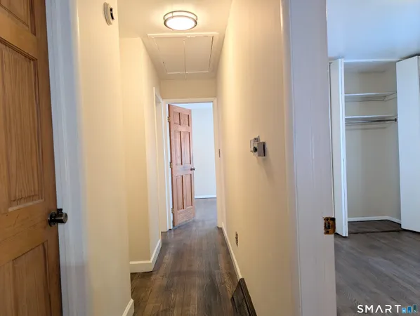 a view of a bathroom from a hallway