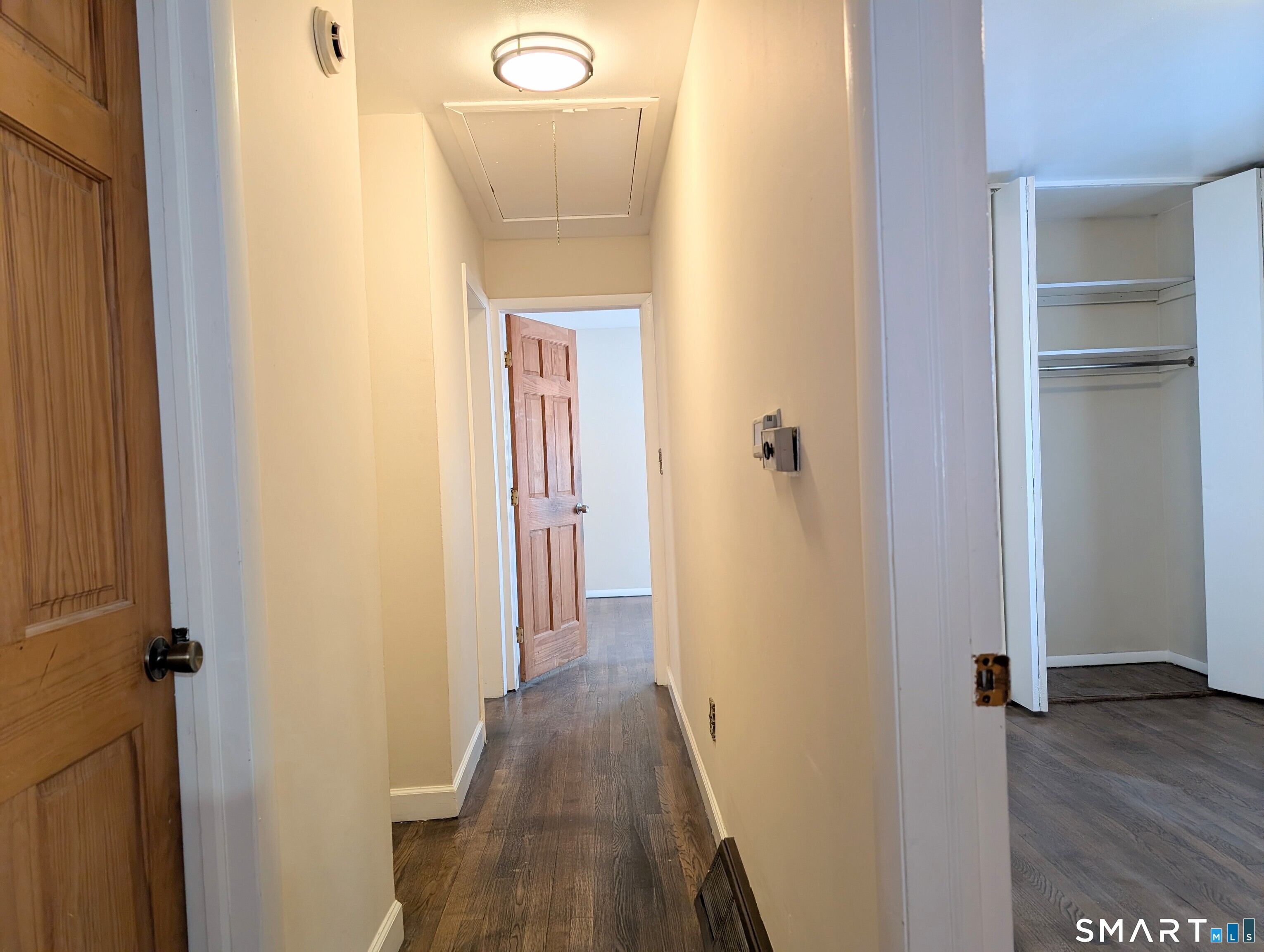 139 Little Deer Road Bridgeport, CT 06606 - Photo 16 of 35 a view of a bathroom from a hallway