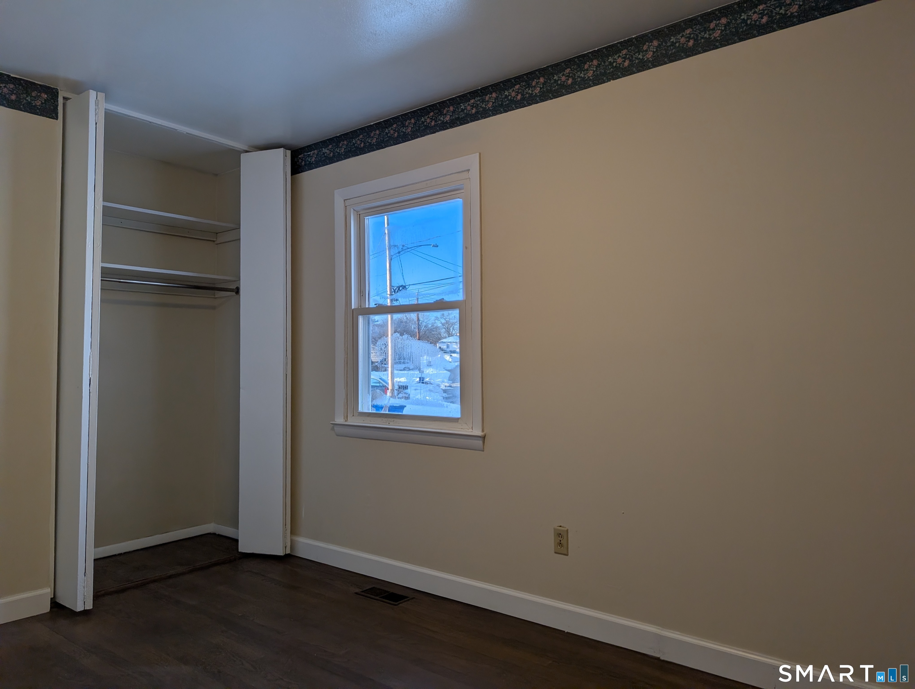 139 Little Deer Road Bridgeport, CT 06606 - Photo 33 of 35 a view of empty room with wooden floor and fan