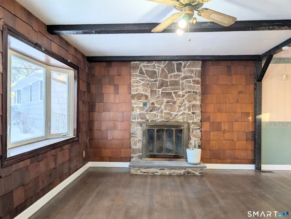 a view of an empty room with a fireplace