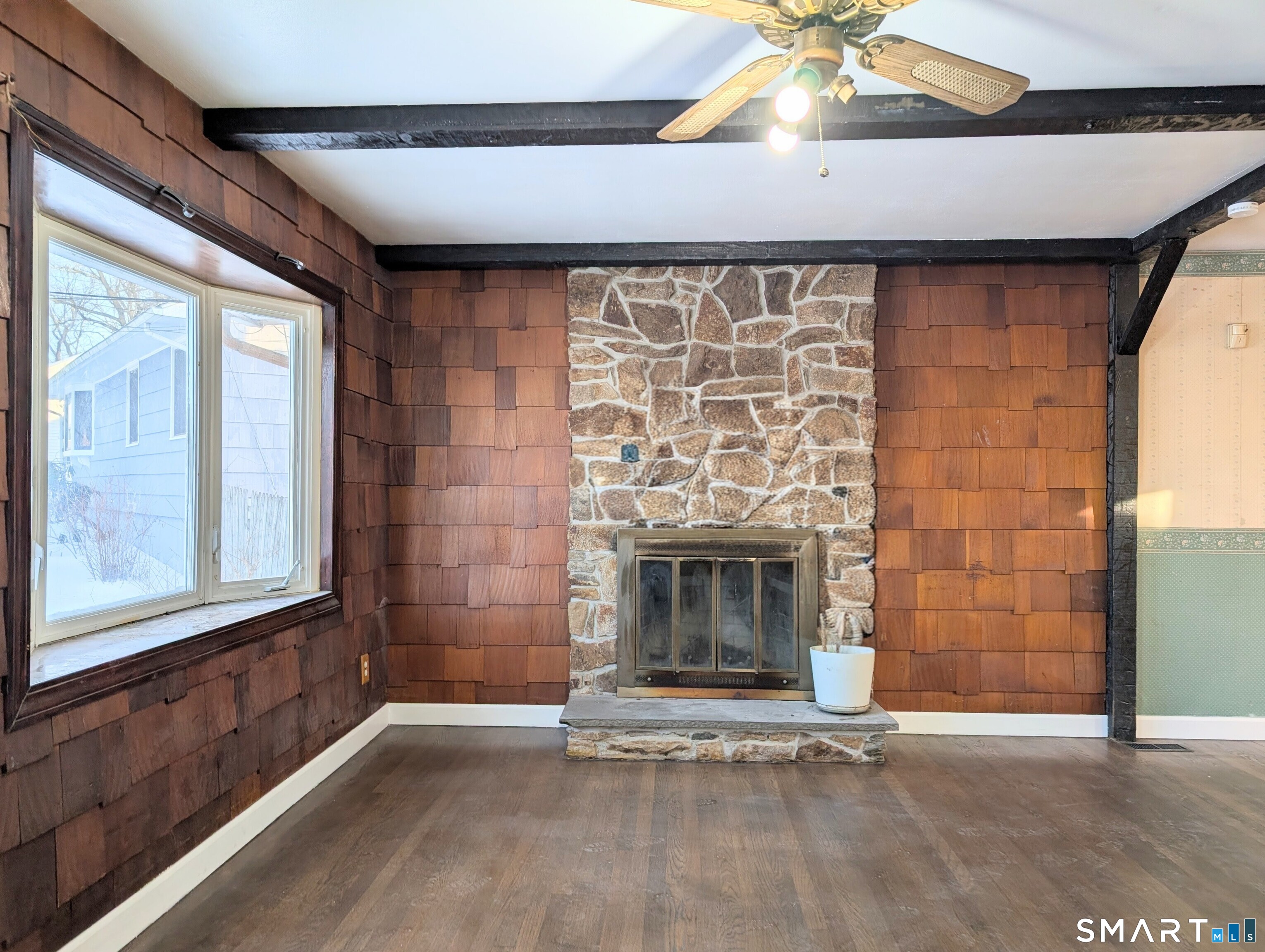 139 Little Deer Road Bridgeport, CT 06606 - Photo 9 of 35 a view of an empty room with a fireplace