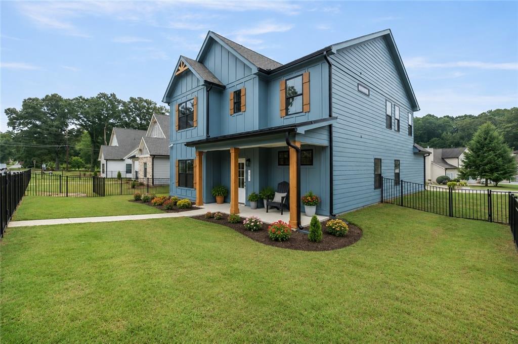 131 Old Alabama Road Southeast Emerson, GA 30137 - Photo 2 of 44 a front view of a house with a yard