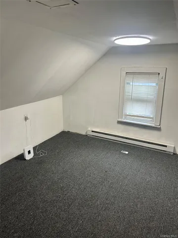 a view of a room with an empty space