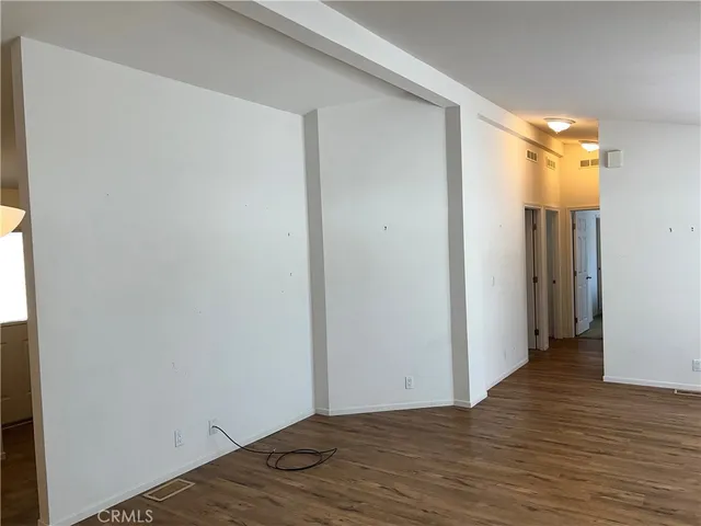 a view of a kitchen with granite countertop cabinets