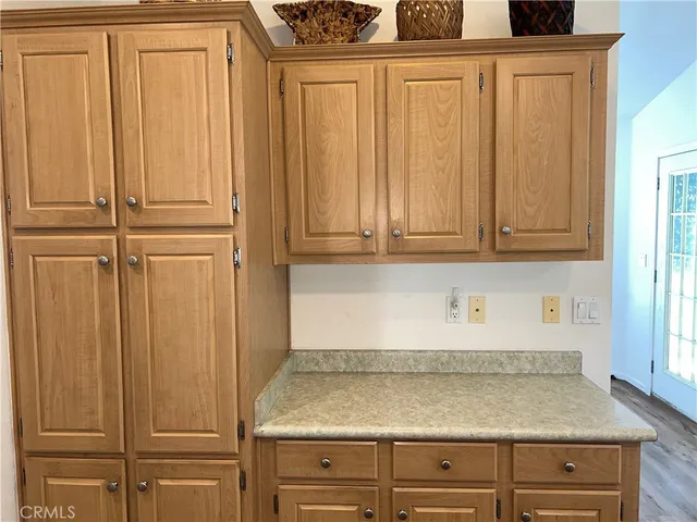a kitchen with a white stove top oven and refrigerator