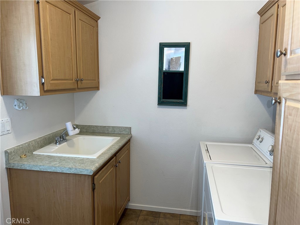 1226 Main Street, Unit 14 Cambria, CA 93428 - Photo 23 of 63 Laundry area w/utility sink