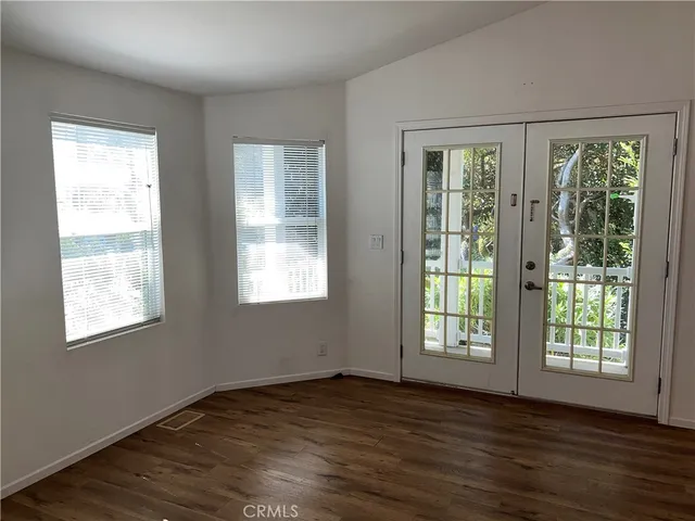 a view of walk in closet with wooden floor