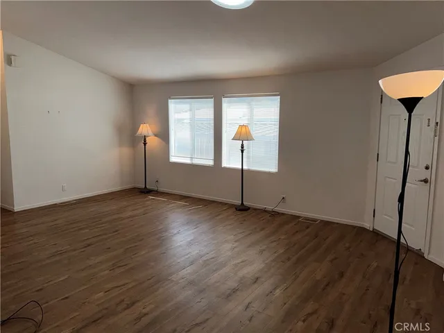 a view of a car parked in front of a house