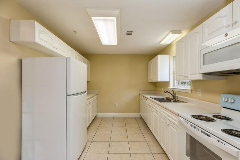 808 Valley Road Crestview, FL 32539 - Photo 12 of 35 a kitchen with a sink a stove and refrigerator