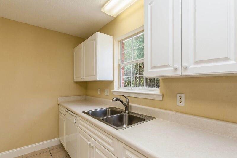 808 Valley Road Crestview, FL 32539 - Photo 14 of 35 a kitchen with a sink and cabinets