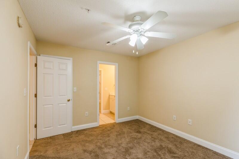 808 Valley Road Crestview, FL 32539 - Photo 17 of 35 an empty room with a ceiling fan and a window