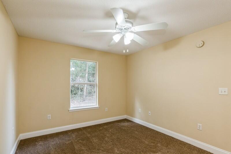 808 Valley Road Crestview, FL 32539 - Photo 18 of 35 an empty room with windows and fan