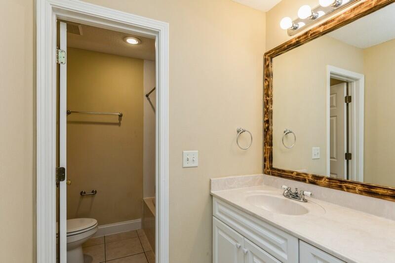 808 Valley Road Crestview, FL 32539 - Photo 19 of 35 a bathroom with a sink and a mirror