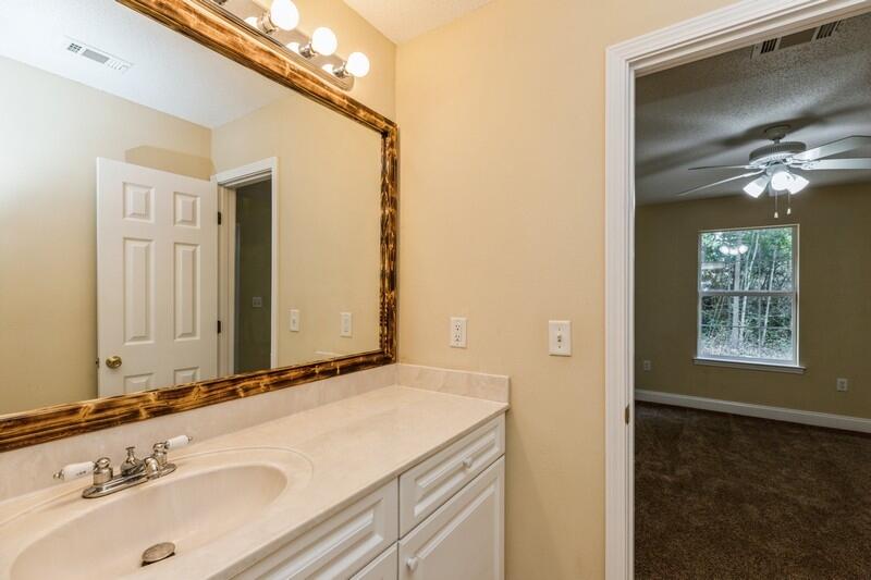 808 Valley Road Crestview, FL 32539 - Photo 20 of 35 a bathroom with a sink and a mirror