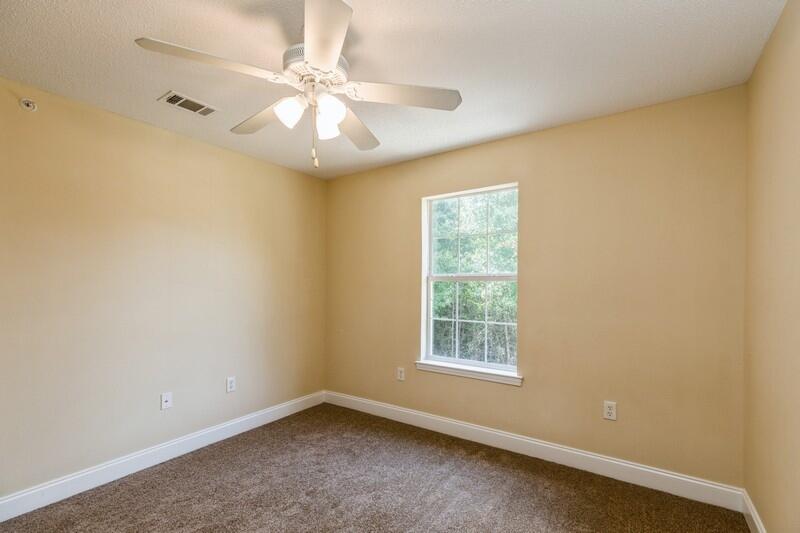808 Valley Road Crestview, FL 32539 - Photo 23 of 35 an empty room with a window and a fan