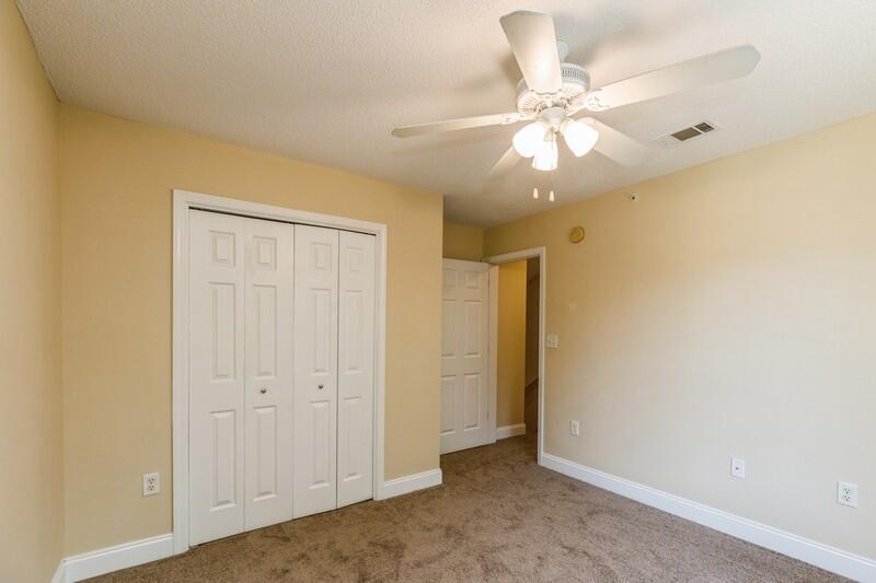 808 Valley Road Crestview, FL 32539 - Photo 24 of 35 an empty room with a ceiling fan and a window