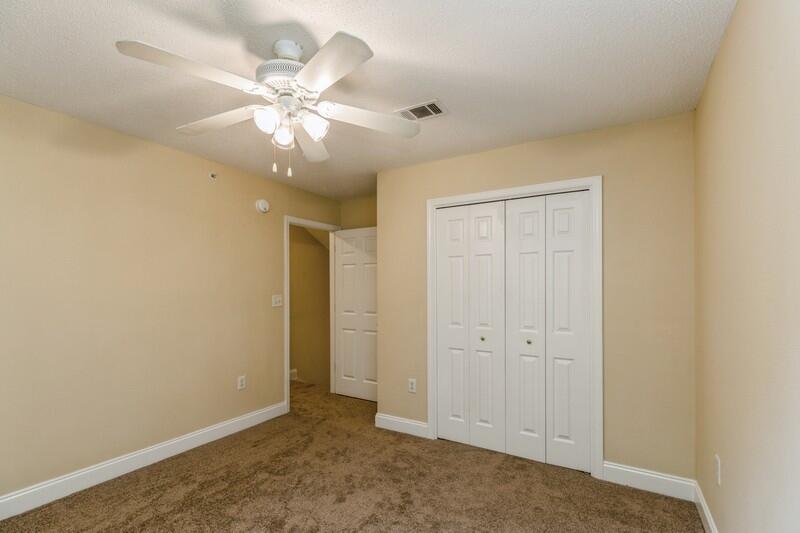 808 Valley Road Crestview, FL 32539 - Photo 27 of 35 an empty room with fan and windows