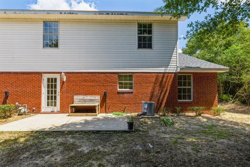 808 Valley Road Crestview, FL 32539 - Photo 34 of 35 a view of a house with backyard and sitting area