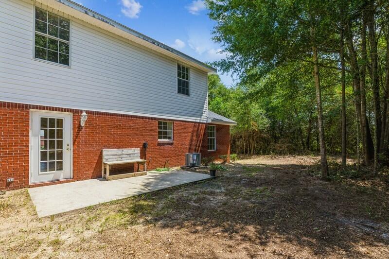 808 Valley Road Crestview, FL 32539 - Photo 35 of 35 a view of a house with backyard and trees