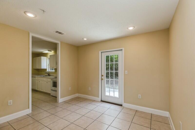 808 Valley Road Crestview, FL 32539 - Photo 10 of 35 a view of empty room with wooden floor and fireplace