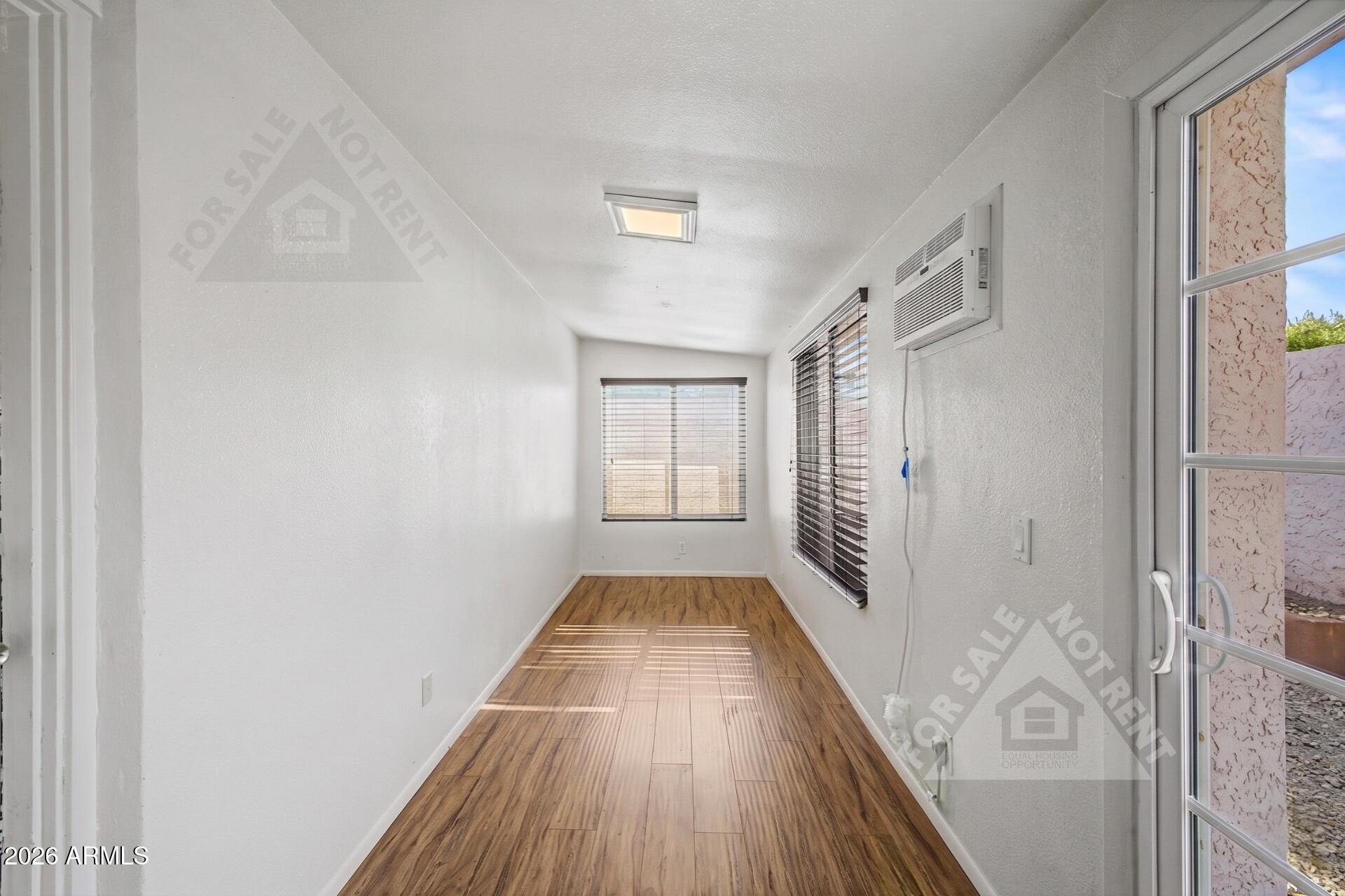912 East Villa Rita Drive Phoenix, AZ 85022 - Photo 22 of 27 a view of a hallway with wooden floor and staircase