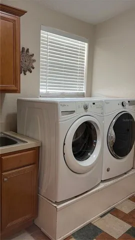 a utility room with dryer and washer