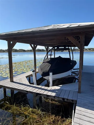 a view of balcony with chairs and wooden floor