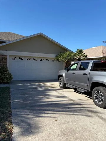 a view of a house with a parking space