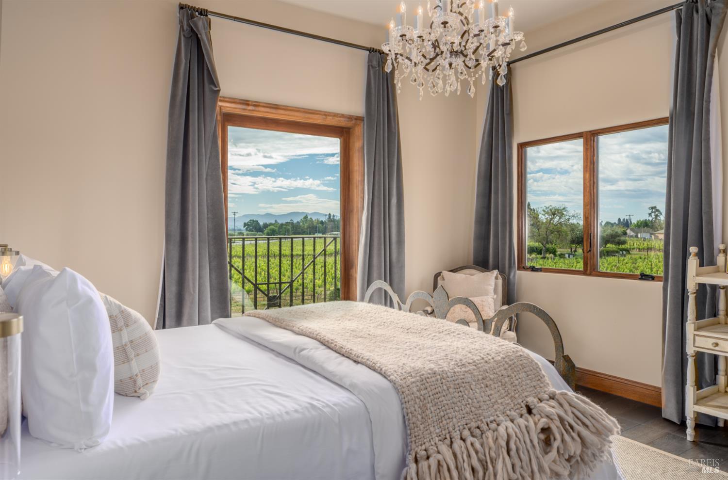 5045 Big Ranch Road Napa, CA 94558 - Photo 35 of 71 a bedroom with a large bed and a large window