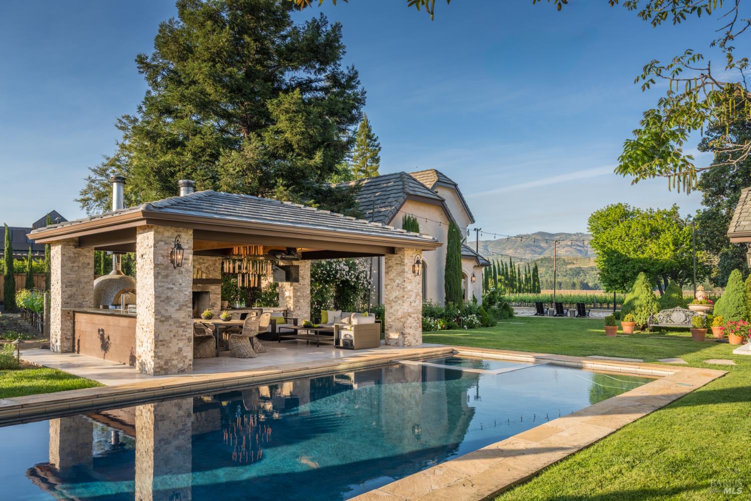 5045 Big Ranch Road Napa, CA 94558 - Photo 4 of 71 swimming pool view with a seating space and a garden view
