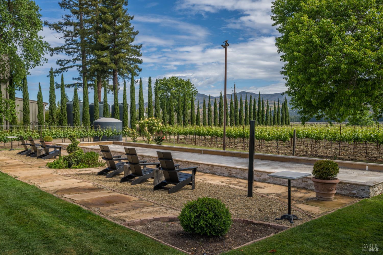 5045 Big Ranch Road Napa, CA 94558 - Photo 48 of 71 a view of a bench in a yard with palm trees