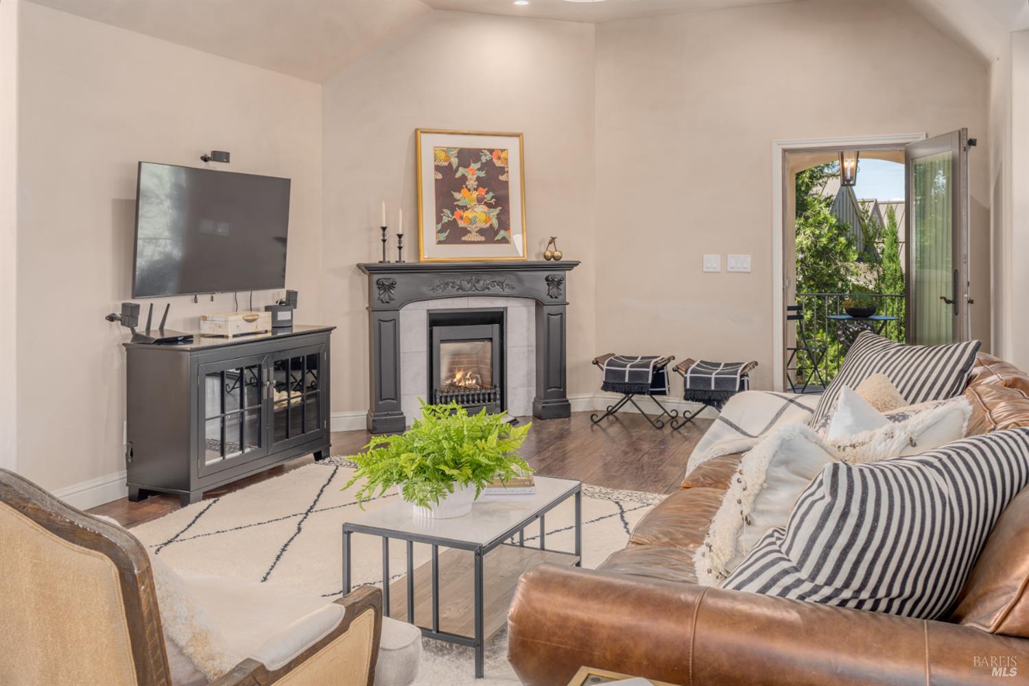 5045 Big Ranch Road Napa, CA 94558 - Photo 52 of 71 a living room with furniture a flat screen tv and a fireplace