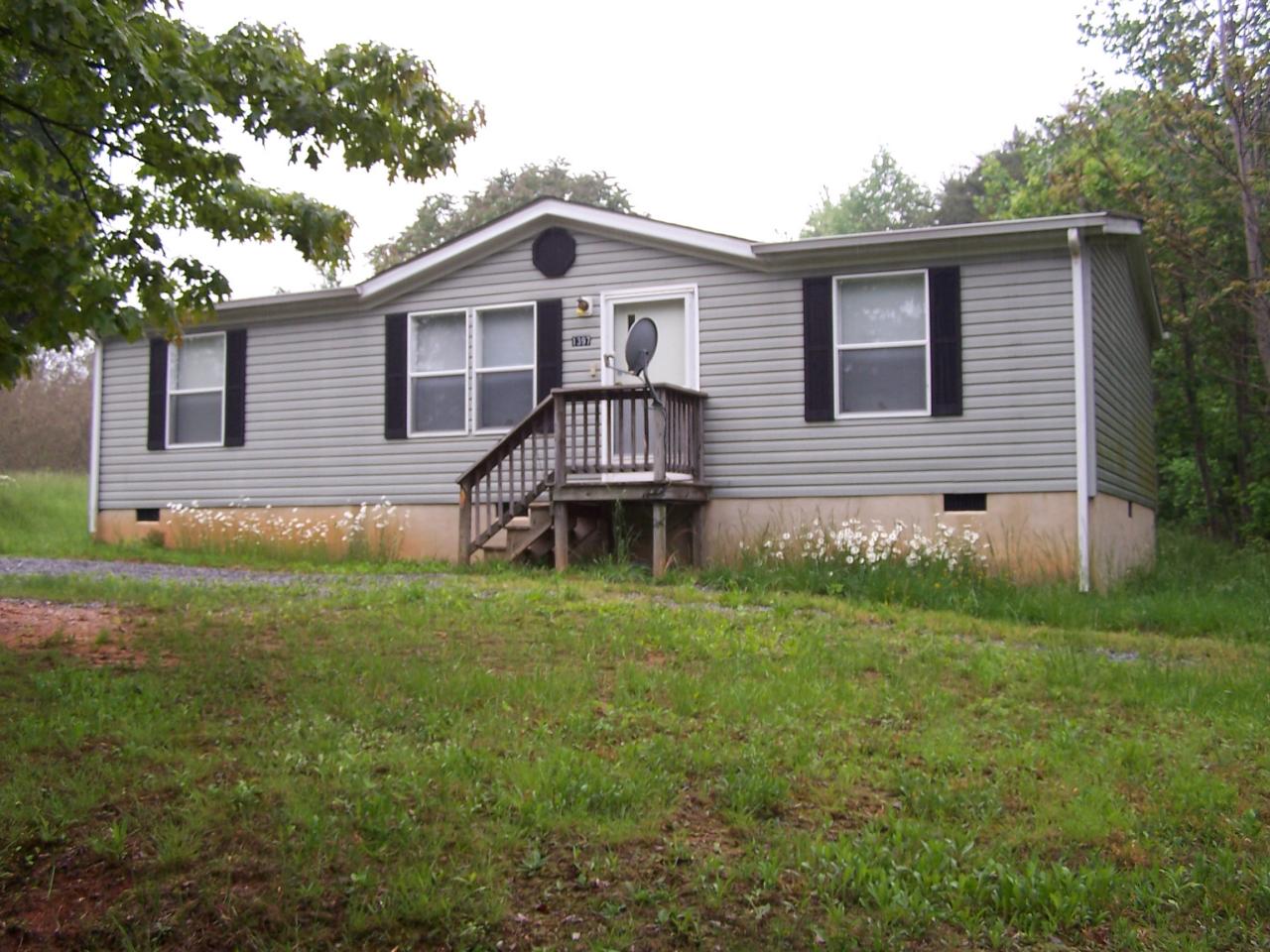 1397 Bottom Meadow Road Thaxton, VA 24174 - Photo 1 of 5 a front view of a house with a yard