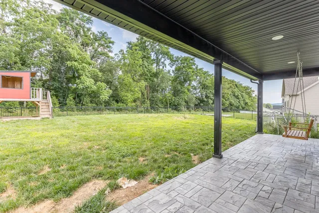 a view of entryway with wooden floor and stairs