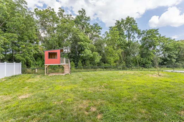 a living room with furniture window and a fireplace