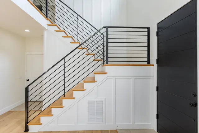 a kitchen with stainless steel appliances white cabinets and a stove