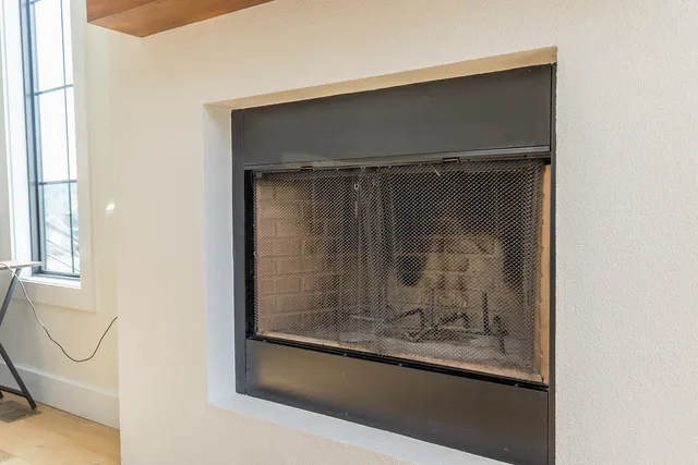 a kitchen with granite countertop white cabinets and stainless steel appliances