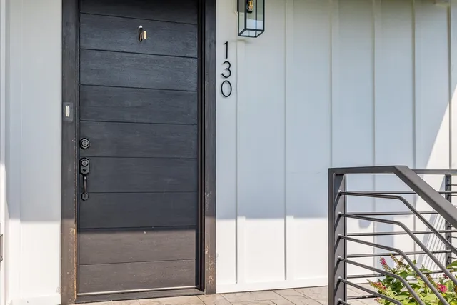 a view of a house with a yard and sitting area