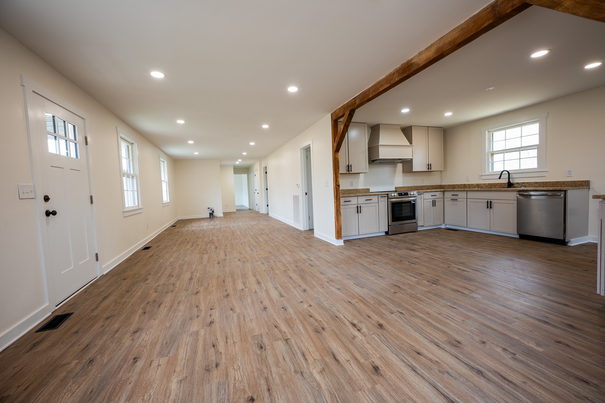 a large kitchen with stainless steel appliances granite countertop a large center island and a sink