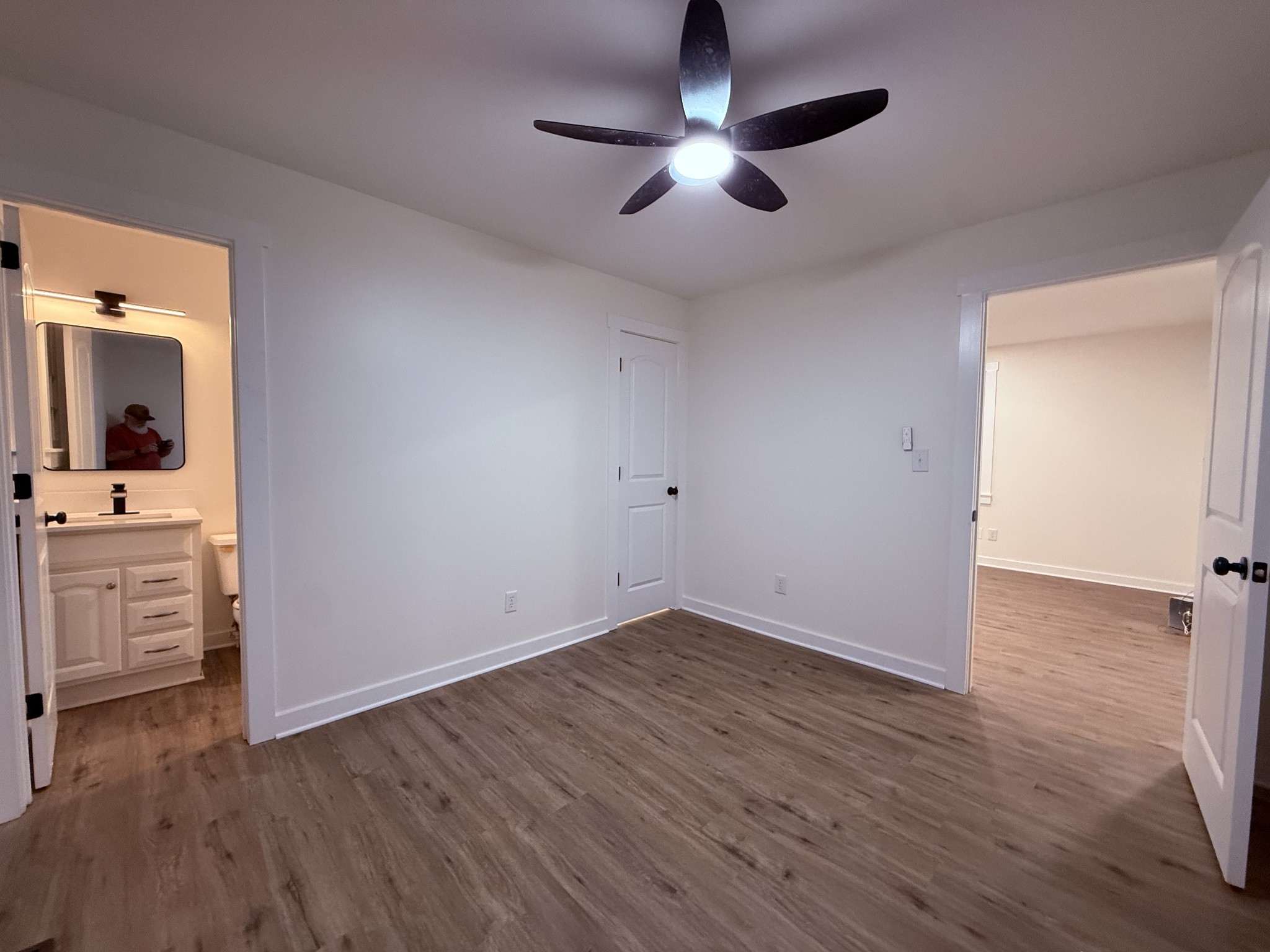 622 Beech Street Centerville, TN 37033 - Photo 11 of 30 wooden floor in an empty room with a kitchen