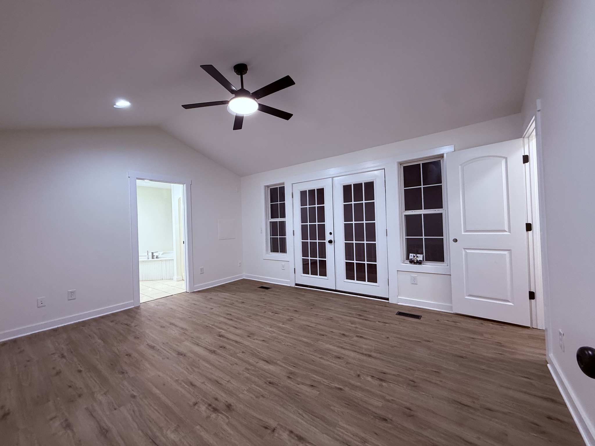 622 Beech Street Centerville, TN 37033 - Photo 13 of 30 a view of an empty room with wooden floor and windows