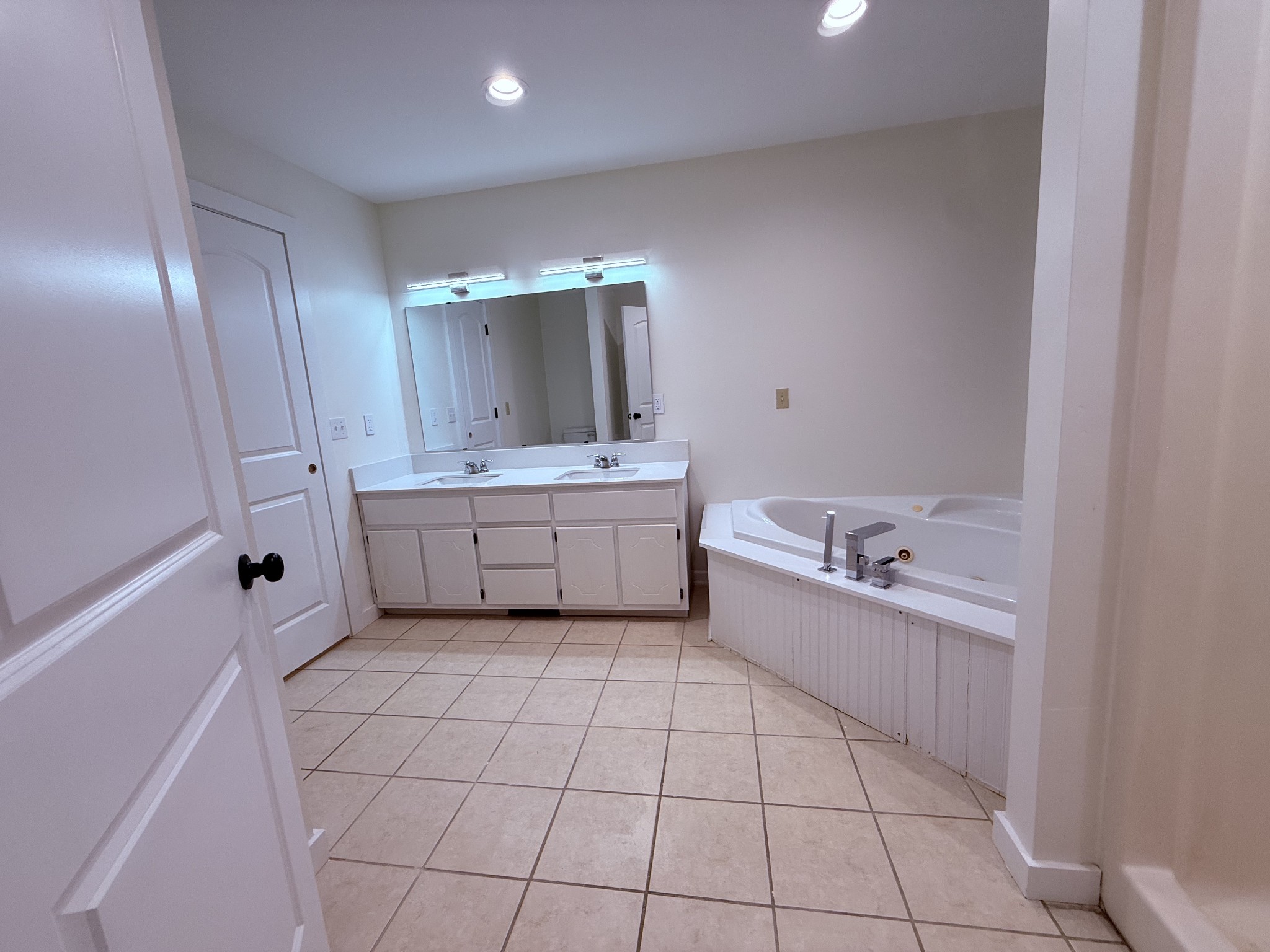 622 Beech Street Centerville, TN 37033 - Photo 15 of 30 a large white kitchen with a sink a toilet and a bathtub