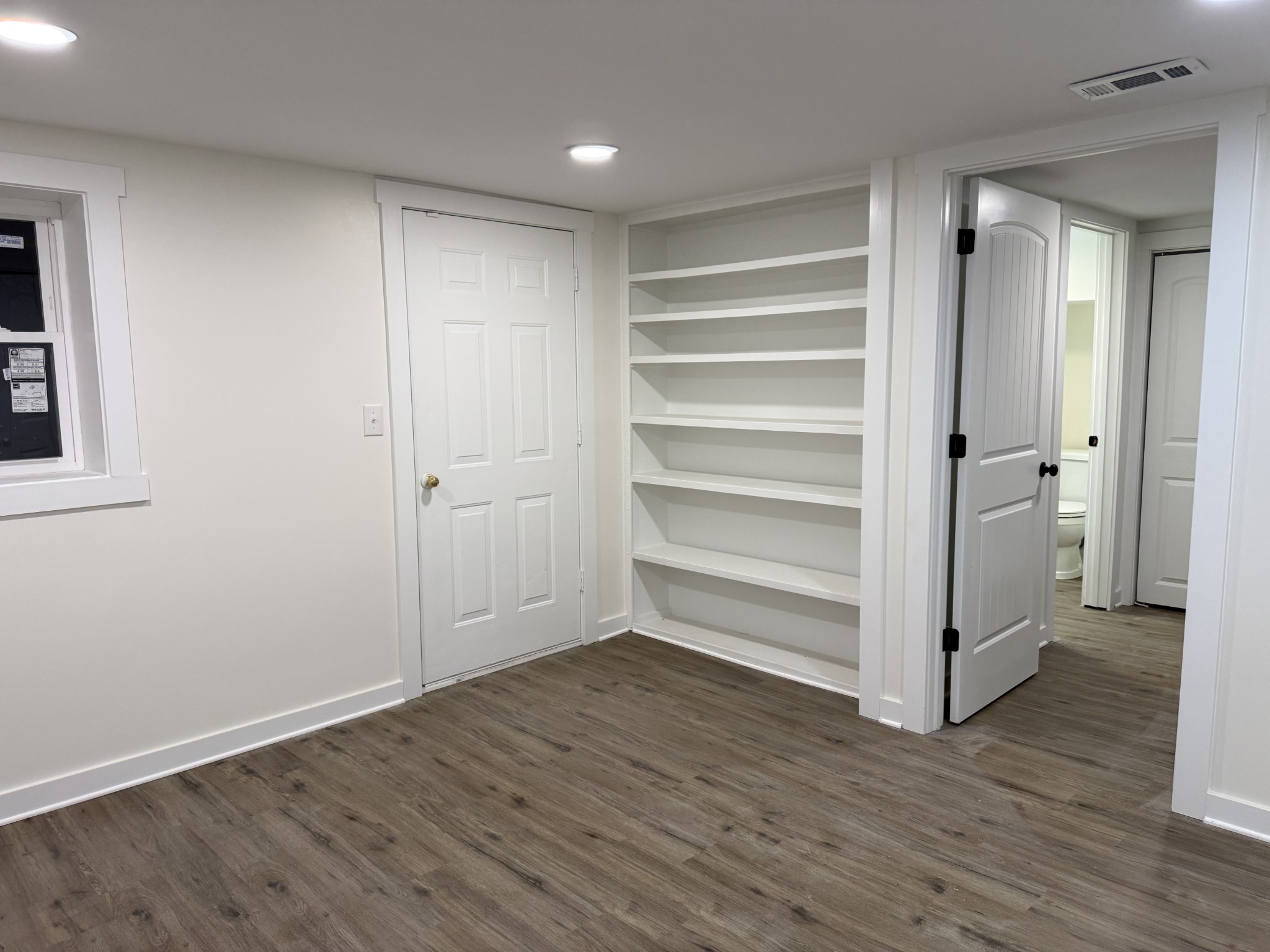 622 Beech Street Centerville, TN 37033 - Photo 25 of 30 a view of an empty room with wooden floor and a window
