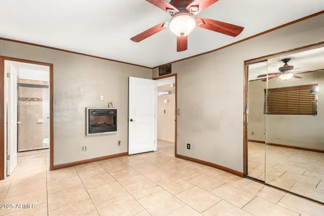 a view of a livingroom with a garage and a chandelier fan