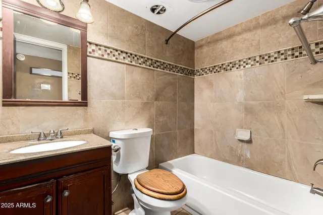 a bathroom with a sink a toilet and a bathtub