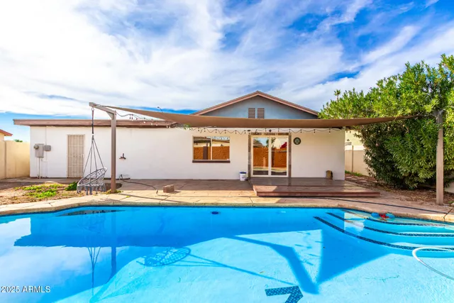 a front view of house with yard slide and outdoor seating