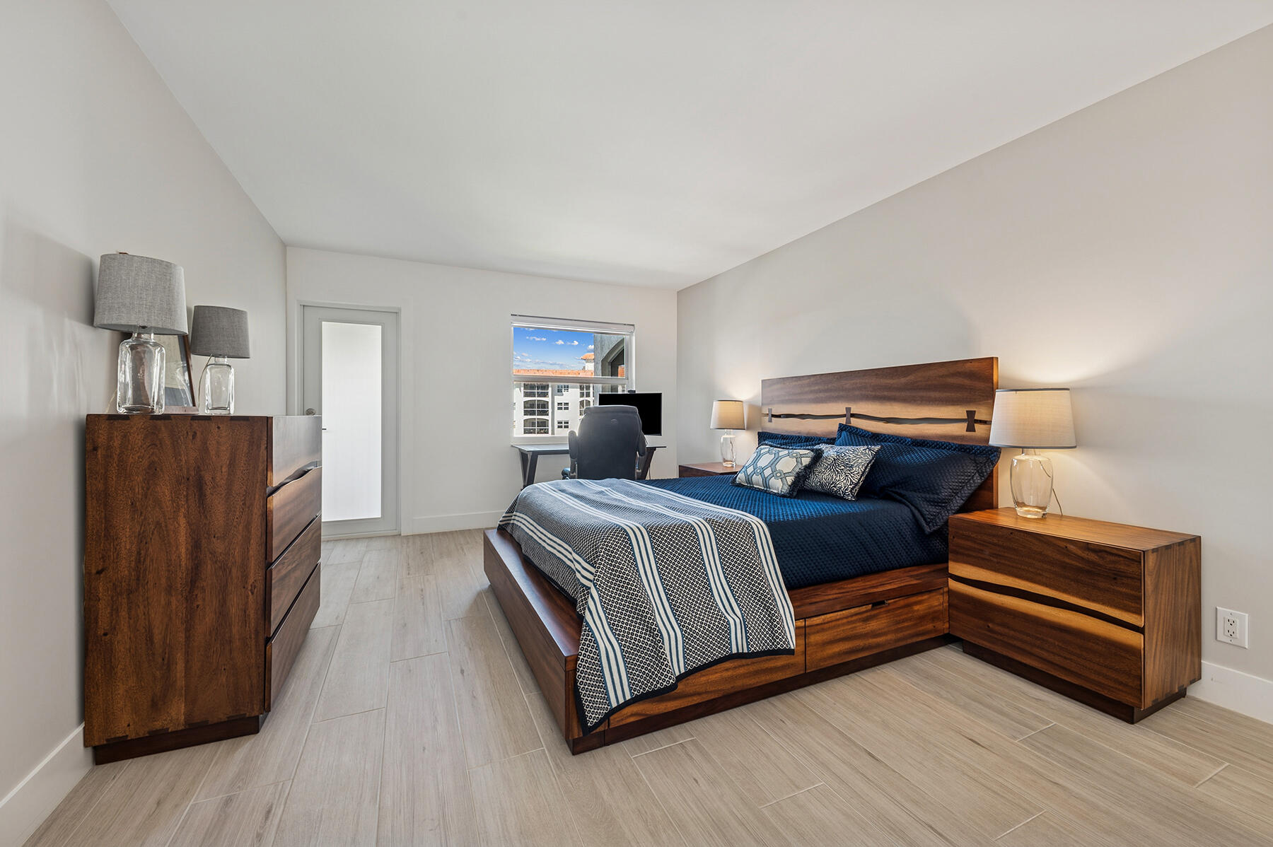 2871 North Ocean Boulevard, Unit M436 Boca Raton, FL 33431 - Photo 12 of 20 a bedroom with a bed and dresser