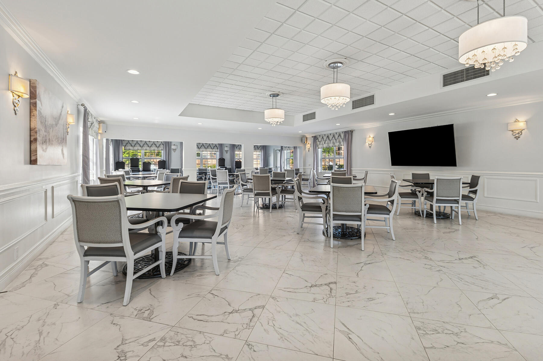 2871 North Ocean Boulevard, Unit M436 Boca Raton, FL 33431 - Photo 19 of 20 a group of people sitting at tables in a living room