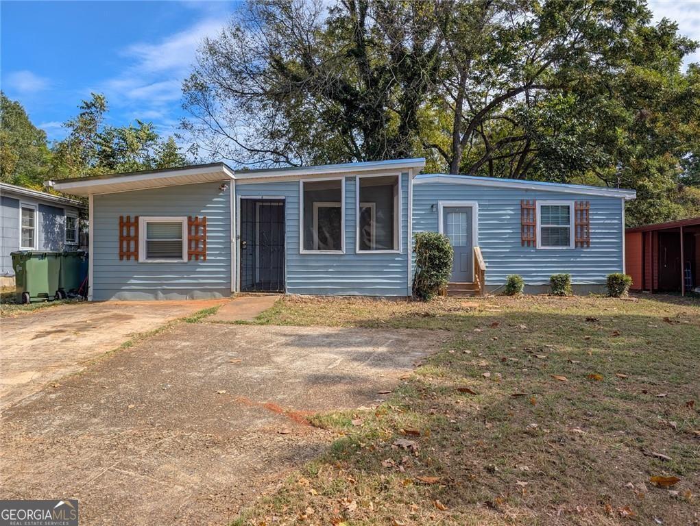 1672 Thornton Place Southwest Atlanta, GA 30315 - Photo 1 of 1 front view of a house with a yard