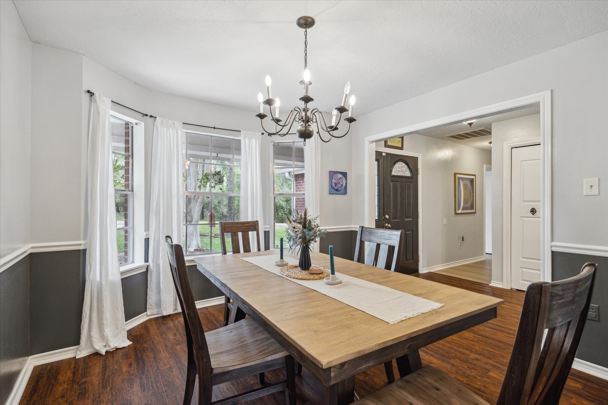 2420 Canter Lane Conroe, TX 77384 - Photo 6 of 24 a view of a dining room with furniture window and wooden floor